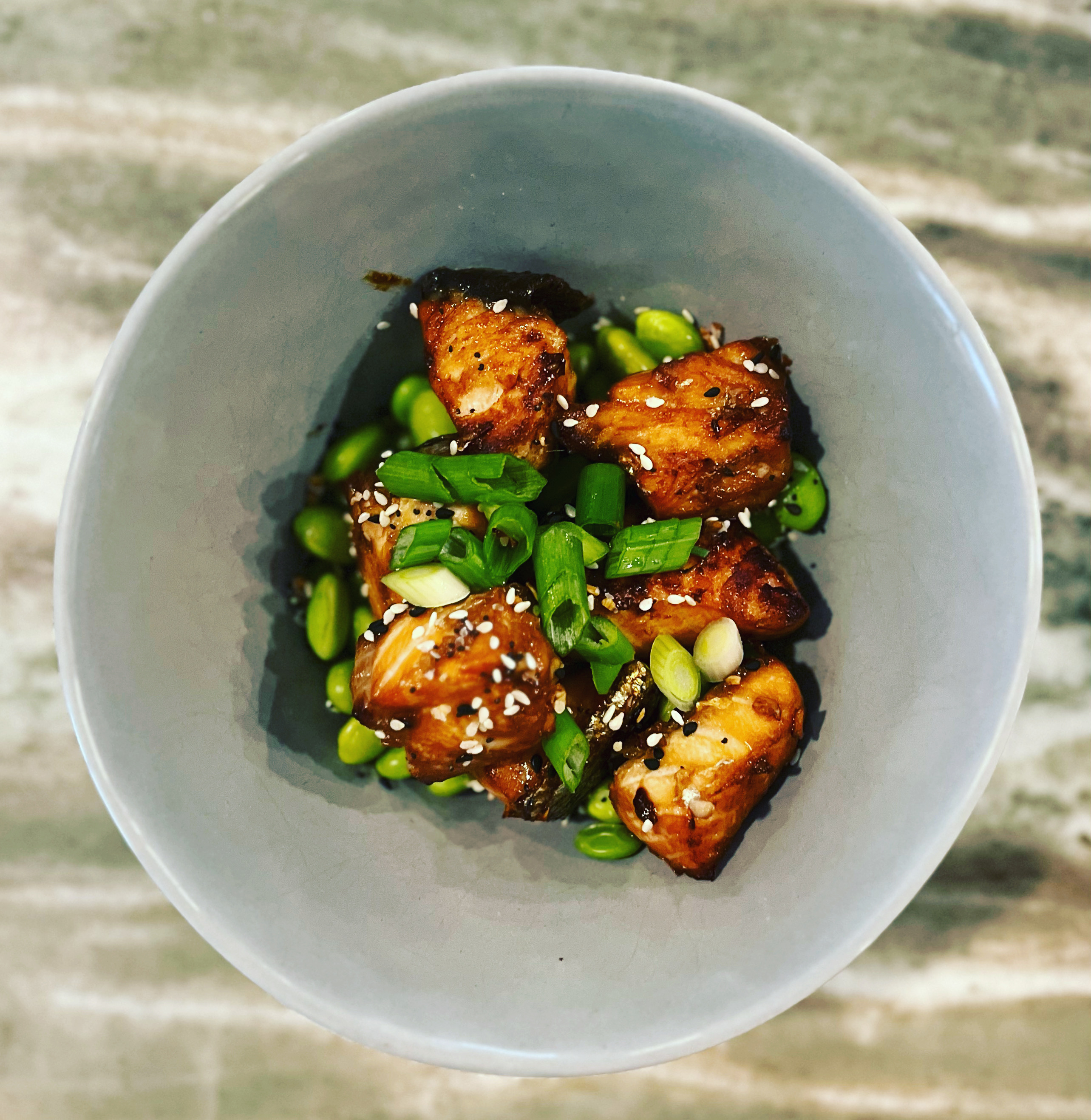 Honey Garlic Salmon Bites over a Bed of Edamame